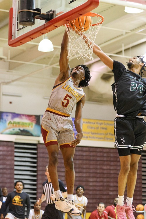 Pasadena's Myles Watkins slams a dunk as the Lancers ended ELAC's long conference win streak.