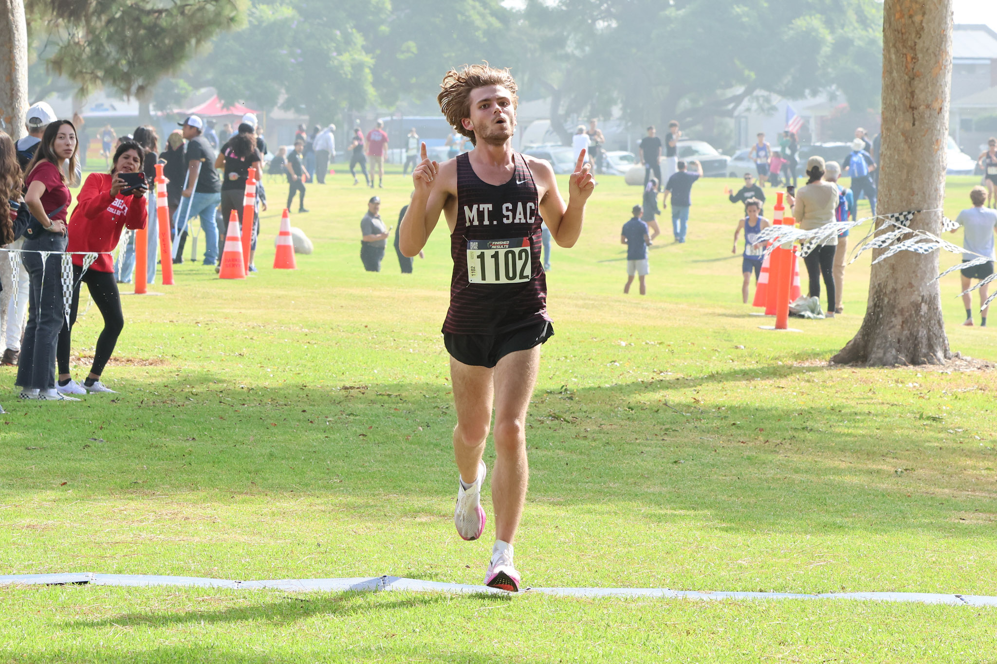 Austin Ledgerwood crosses the finish line to win the SCC men's cross country title (photo by Richard Quinton).